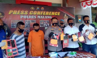 Kapolres Malang AKBP Hendri saat merilis kasus pemerasan yang mengaku anggota dari Sat Intelkam Polda Jatim. (memo x/ cw3)