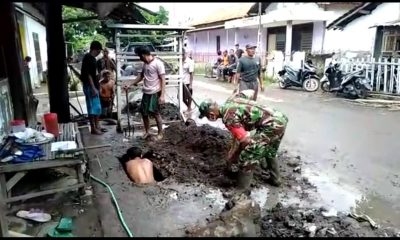 Antisipasi Banjir, Babinsa Ketah Situbondo bersama Warga Bersihkan Drainase