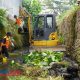 Satgas Drainase Kota Malang Dibantu Ekskavator Lakukan Pengerukan Sedimen di Saluran Sekunder